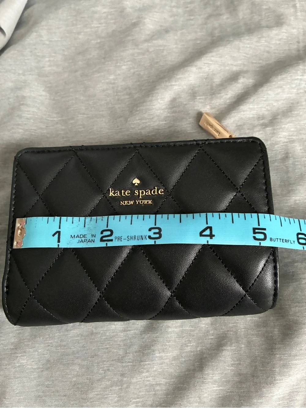 kate spade Medium Black Quilted Leather Zip-Around Wallet with Gold Logo